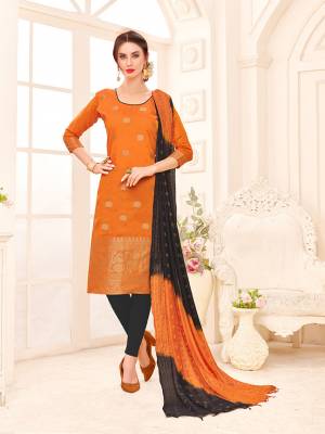 If Those Readymade suit Does Not Lend You The Desired Comfort Than Grab This Dress Material In Orange Colored Top Paired With Black Colored Bottom And Orange And Black Colored Shaded Dupatta. Its Top And Dupatta Are Banarasi Jacquard Silk Based Paired With Cotton Fabricated Bottom. 