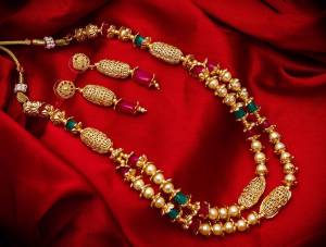 New And Unique Patterned Designer Necklace Set Is Here In Golden Color With Double Layer. It Is Beautified With Pearl Work And Also Light In Weight And Can Be Paired With Any Colored Ethnic Attire.