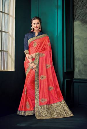 Celebrate This Festive Season With Beauty And Comfort Wearing This Designer Saree In Old Rose Pink Color Paired With Contrasting Navy Blue Colored Blouse. This Saree And Blouse are Silk Based With Jacquard Silk Pallu. Buy This Designer Piece For A Proper Traditional Wear. 