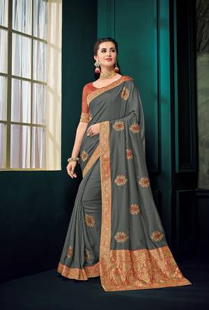 You Will Definitely Earn Lots Of Compliments With Rich Color Pallete Wearing This Designer Saree In Dark Grey Color Paired With Contrasting Rust. This Saree And Blouse Are Silk Beautified With Embroidered Butti All Over And Highlited With Jacquard Silk Pallu. Buy Now.