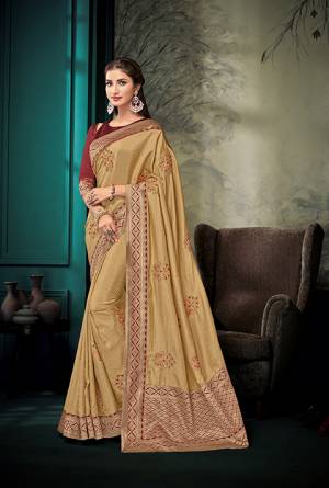 Celebrate This Festive Season With Beauty And Comfort Wearing This Designer Saree In Beige Color Paired With Contrasting Maroon Colored Blouse. This Saree And Blouse are Silk Based With Jacquard Silk Pallu. Buy This Designer Piece For A Proper Traditional Wear. 