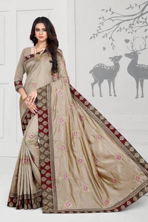 Rich And Elegant Looking Designer Silk Based Saree Is Here In Sand Grey Color Paired With Sand Grey Colored Blouse. This Saree And Blouse Are Fabricated On Art Silk Beautified With Embroidered Butti And Attractive Lace Border. 