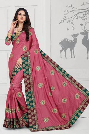 Rich And Elegant Looking Designer Silk Based Saree Is Here In Pink Color Paired With Pink Colored Blouse. This Saree And Blouse Are Fabricated On Art Silk Beautified With Embroidered Butti And Attractive Lace Border. 