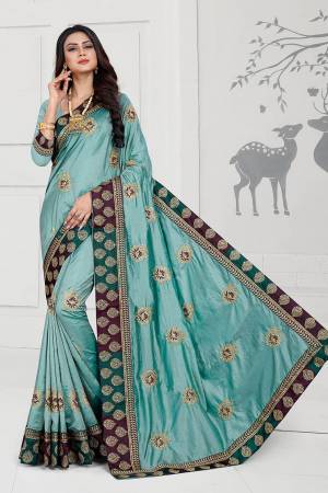Rich And Elegant Looking Designer Silk Based Saree Is Here In Turquoise Blue Color Paired With Turquoise Blue Colored Blouse. This Saree And Blouse Are Fabricated On Art Silk Beautified With Embroidered Butti And Attractive Lace Border. 