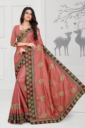 Rich And Elegant Looking Designer Silk Based Saree Is Here In Rust Color Paired With Rust Colored Blouse. This Saree And Blouse Are Fabricated On Art Silk Beautified With Embroidered Butti And Attractive Lace Border. 