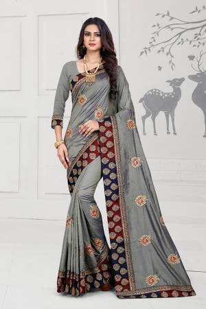 Rich And Elegant Looking Designer Silk Based Saree Is Here In Grey Color Paired With Grey Colored Blouse. This Saree And Blouse Are Fabricated On Art Silk Beautified With Embroidered Butti And Attractive Lace Border. 