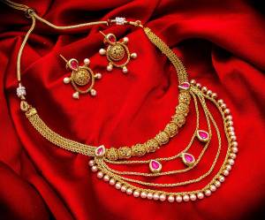 Grab This Heavy Necklace Set For The Upcoming Wedding Season. Pair This Up With Your Heavy Ethnic Attire And As It Is In Golden Color, It Can Be Paired With Any Colored Attire. Buy Now