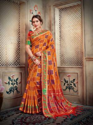 Go Colorful With This Designer Silk Based Saree In Orange Color Paired With Contrasting Red Colored Blouse. This Saree And Blouse Are Fabricated On Lichi Art Silk Beautified With Weave All Over. 