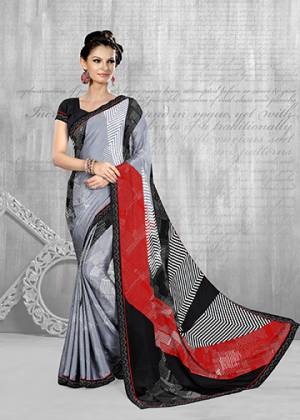For Your Semi-Casuals, Grab This Pretty Printed Saree In Grey And Black Color Paired With Black Colored Blouse. This Saree And Blouse Are Fabricated On Crepe Beautified With Prints All Over. Buy Now.