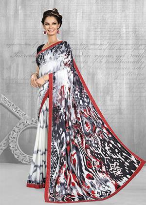 Add This Pretty Saree To Your Wardrobe In White & Black Color Paired With Black Colored Blouse. This Saree And Blouse Are Fabricated On Crepe Beautified With Abstract Prints All Over It. Buy Now.