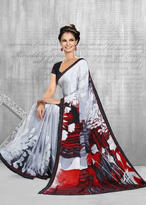 For Your Semi-Casuals, Grab This Pretty Printed Saree In White And Grey Color Paired With Black Colored Blouse. This Saree And Blouse Are Fabricated On Crepe Beautified With Prints All Over. Buy Now.