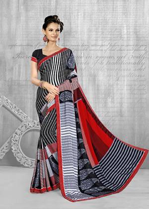 For Your Semi-Casuals, Grab This Pretty Printed Saree In Black & Red Color Paired With Black Colored Blouse. This Saree And Blouse Are Fabricated On Crepe Beautified With Prints All Over. Buy Now.