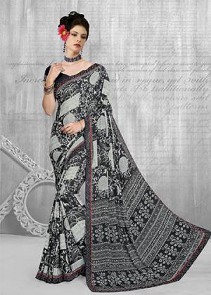 Add This Pretty Saree To Your Wardrobe In Black & Grey Color Paired With Black Colored Blouse. This Saree And Blouse Are Fabricated On Crepe Beautified With Abstract Prints All Over It. Buy Now.