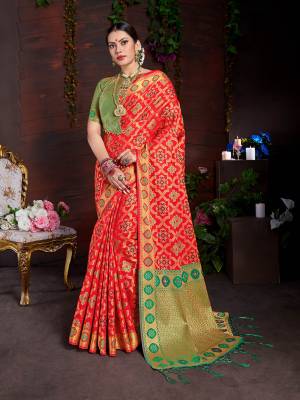 Enhance Your Personality Wearing This Designer Silk Based Saree In Red Color Paired With Contrasting Green Colored Blouse. This Saree And Blouse Are Fabricated On Lichi Art Silk Beautified With Weave All Over. Buy This Saree Now.