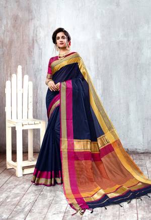 Enhance Your Personality In This Rich And Elegant Looking Saree In Navy Blue Color Paired With Contrasting Magenta Pink Colored Blouse. This Saree And Blouse Are Fabricated On Cotton Silk Which Is Light Weight And Easy To Carry All Day Long. 