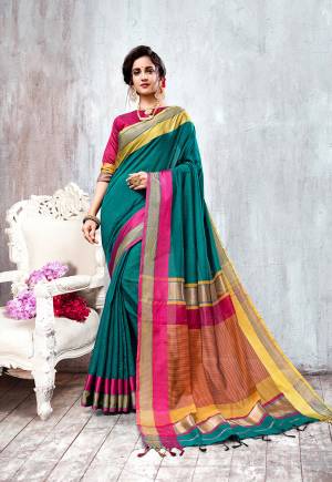 New Shade Is Here To Add Into Your Wardrobe With This Elegant Looking Saree In Teal Blue Color Paired With Contrasting Rani Pink Colored Blouse. This Saree And Blouse Are Fabricated On Cotton Silk Beautified With Weave All Over. 