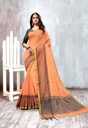 Here Is Rich and Elegant Looking Mustu Have Patterned Saree IS Here In Peach Color Paired With Grey Colored Blouse. This Saree And Blouse Are Fabricated On Cotton Silk Beautified With Attractive Lace Border.