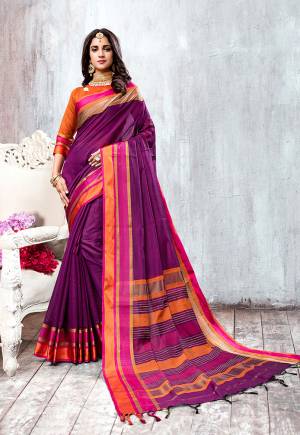 Beautiful Shade Is Here To Add Into Your Wardrobe With This Elegant Looking Saree In Purple Color Paired With Contrasting Orange Colored Blouse. This Saree And Blouse Are Fabricated On Cotton Silk Beautified With Weave All Over. 