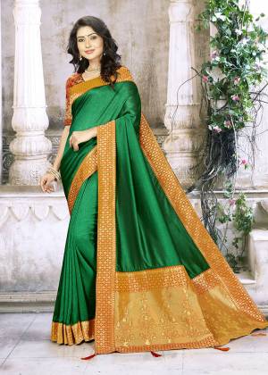 Grab This Beautiful And Attractive Looking Designer Saree In Green Color Paired With Contrasting Orange Colored Blouse. This Saree Is Fabricated On Chinon Silk Paired With Jacquard Silk Fabricated Blouse. 