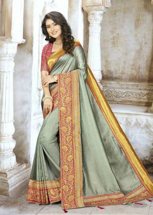 Flaunt Your Rich And Elegant Taste Wearing This Designer Saree In Grey Color Paired With Contasting Dark Pink Colored Blouse. This Saree Is Fabricated On Chinon Silk Paired With Jacquard Silk Fabricated Blouse. Buy This Saree Now.