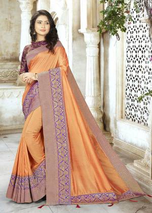 Bright And Visually Appealing Color Is Here With This Designer Saree In Orange Color Paired With Contrasting Purple Colored Blouse. This Saree Is Fabricated On Chinon Silk Paired With Jacquard Silk Fabricated Blouse. Buy Now.