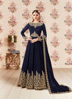 Add This Beautiful Designer Floor Length Suit To Your Wardrobe In Navy Blue Color Paired With Navy Blue  Colored Bottom And Dupatta. Its Heavy Embroidered Top Is Fabricated On Georgette Paired With Santoon bottom And Georgette Fabricated Dupatta. Buy Now.