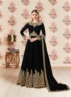 Add This Beautiful Designer Floor Length Suit To Your Wardrobe In Black Color Paired With Black Colored Bottom And Dupatta. Its Heavy Embroidered Top Is Fabricated On Georgette Paired With Santoon bottom And Georgette Fabricated Dupatta. Buy Now.