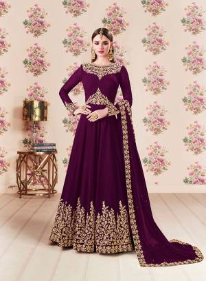 Add This Beautiful Designer Floor Length Suit To Your Wardrobe In Wine Color Paired With Wine Colored Bottom And Dupatta. Its Heavy Embroidered Top Is Fabricated On Georgette Paired With Santoon bottom And Georgette Fabricated Dupatta. Buy Now.