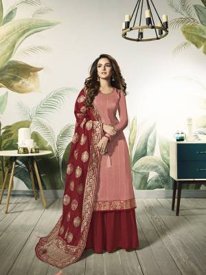 Add This Very Pretty Designer Indo-Western Suit To Your Wardrobe For The Upcoming Festive And Wedding Season. Its Dark Peach Colored Top Is Fabricated On Satin Silk Paired With Contrasting Red Colored Bottom And Dupatta. Its Bottom Is Fabricated On Santoon Paired With Jacquard Silk Fabricated Dupatta. Buy Now.