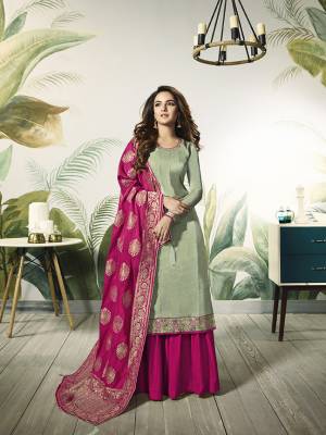 Add This Very Pretty Designer Indo-Western Suit To Your Wardrobe For The Upcoming Festive And Wedding Season. Its Pastel Green Colored Top Is Fabricated On Satin Silk Paired With Contrasting Rani Pink Colored Bottom And Dupatta. Its Bottom Is Fabricated On Santoon Paired With Jacquard Silk Fabricated Dupatta. Buy Now.