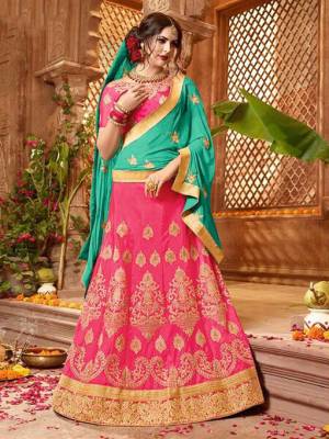 Bright And Visually Appealing Color Pallete Is Here With This Designer Lehenga Choli In Dark Pink Color Paired With Contrasting Sea Green Colored Dupatta. Its Blouse And Lehenga Are Fabricated On Art Silk Paired With Chiffon Fabricated Dupatta. Buy Now.