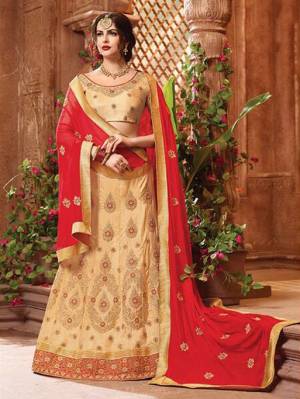 Add This Very Beautiful Designer Lehenga Choli In Beige Color Paired With Red Colored Dupatta. This Lehenga Choli Is Fabricated On Art Silk Paired With Chiffon Fabricated Dupatta. 