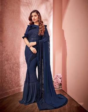 It?s a clash of style and sophistication as season's most covetable frills combine with the classic and timeless saree. Opt for an open falling pallu drape to make the most of the saree.