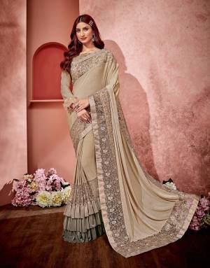 Shaded frills and subtle embroideries make a strong case of fashion in this simple yet outstanding saree. 