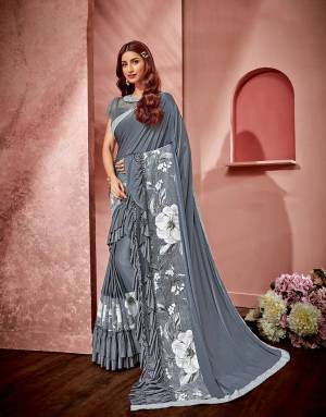 A design that has all you need- elegance, flowers, ruffles and style- enough reasons to make this saree your very own.