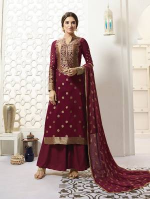 For A Royal And Elegant Look, Grab This Designer Straight Suit In Maroon Color Paired With Maroon Colored Bottom And Dupatta, Its Pretty Weaved Top Is Fabricated On Banarasi Silk Paired With Santoon Bottom And Chiffon Fabricated Dupatta. It Is Light In Weight And Easy To Carry All Day Long. 