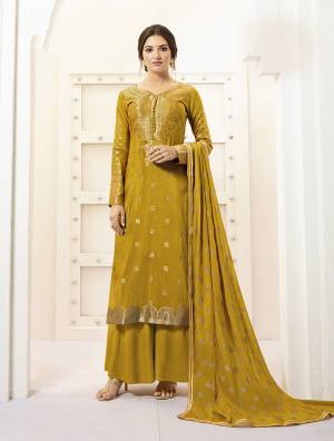 Celebrate This Festive Season Wearing This Designer Straight Suit In Musturd Yellow Color Paired With Musturd Yellow Colored Bottom And Dupatta. Its Top IS Fabricated On Banarasi Silk Paired With Paired With Santoon Bottom And Chiffon Fabricated Dupatta. Buy Now.