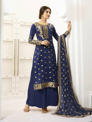 Shine Bright In This Designer Straight Suit In Royal Blue Color Paired With Royal Blue Colored Bottom And Dupatta, Its Top Is Fabricated On Banarasi Silk Paired With Santoon Bottom And Chiffon Fabricated Dupatta.