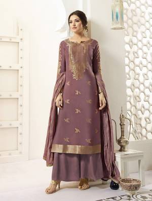 Beautiful Shade In Pink Purple Is Here With This Designer Straight Suit In Mauve Color Paired With Mauve Colored Bottom And Dupatta. It Beautiful And Attractive Looking Top Is Fabricated On Banarasi Silk Beautified With Weave Paired With Santoon Bottom And Chiffon Fabricated Dupatta. 