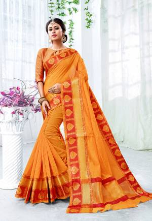 Celebrate This Festive Season With Beauty, Comfort A Beautiful Touch Of Traditional Colors With This Designer Saree In Orange Color Paired With Contrasting Red Colored Blouse. This Saree Is Fabricated On Cotton Silk Paired With Brocade Fabricated Blouse. It Is Beautified With Weave Giving It An Enhanced Look.