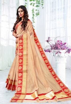 Add This Beautiful Designer Saree To Your Wardrobe For The Upcoming Festive And Wedding Season With This Silk Based Saree In Beige Color Paired With Contrasting Red Colored Blouse. This Saree Is Fabricated On Cotton Silk Paired With Brocade Fabricated Blouse. 