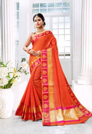 Celebrate This Festive Season With Beauty, Comfort A Beautiful Touch Of Traditional Colors With This Designer Saree In Orange Color Paired With Contrasting Dark Pink Colored Blouse. This Saree Is Fabricated On Cotton Silk Paired With Brocade Fabricated Blouse. It Is Beautified With Weave Giving It An Enhanced Look.