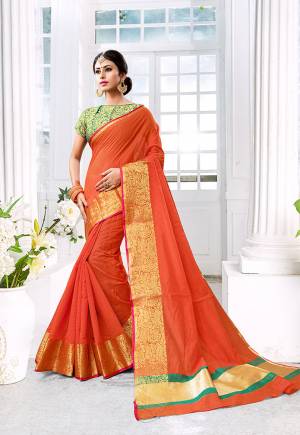Celebrate This Festive Season With Beauty, Comfort A Beautiful Touch Of Traditional Colors With This Designer Saree In Orange Color Paired With Contrasting Green Colored Blouse. This Saree Is Fabricated On Cotton Silk Paired With Brocade Fabricated Blouse. It Is Beautified With Weave Giving It An Enhanced Look.