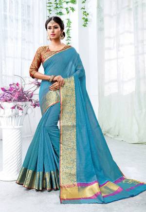 Add This Beautiful Designer Saree To Your Wardrobe For The Upcoming Festive And Wedding Season With This Silk Based Saree In Blue Color Paired With Contrasting Maroon Colored Blouse. This Saree Is Fabricated On Cotton Silk Paired With Brocade Fabricated Blouse. 