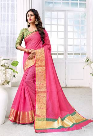Look Pretty In This Designer Silk Based Saree In Pink Color Paired With Contrasting Green Colored Blouse. This Saree Is Fabricated On Cotton Silk Paired With Brocade Fabricated Blouse. It Is Beautified With Weave All Over Giving It An Attractive Look. 