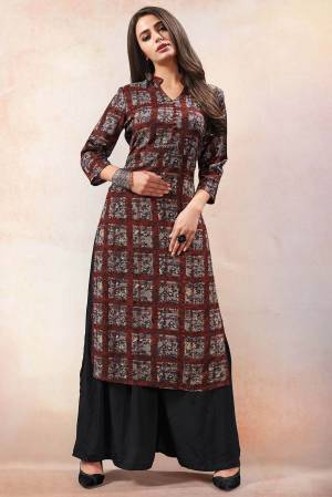 Add This Pretty Readymade Kurti To Your Wardrobe In Brown Color Fabricated On Rayon. This Kurti Is Beautified With Prints And Also Light Weight Which Is Easy To Carry All Day Long. 