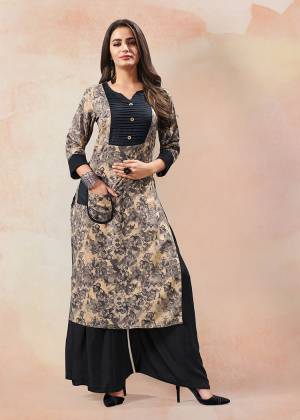 Simple And Elegant Looking Straight Kurti Is Here In Grey And Black Color Fabricated On Rayon. This Kurti Is Light Weight And Can Be Paired With Same Of Contrasting Colored Bottom. Buy This Readymade Kurti Now.