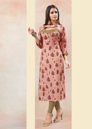 Go Colorful With This Peach Colored Readymade Kurti Fabricated On Rayon. This Kurti Is Beautified With Prints And Suitable For Your Casual And Semi-Casuals. 