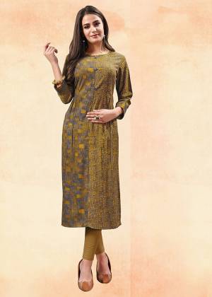 Simple And Elegant Looking Straight Kurti Is Here In Yellow And Grey Color Fabricated On Rayon. This Kurti Is Light Weight And Can Be Paired With Same Of Contrasting Colored Bottom. Buy This Readymade Kurti Now.