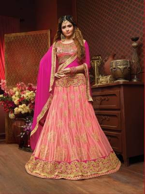 Go With The Pretty Shades Of Pink With This Heavy Designer Lehenga Choli In Dark Pink Colored Blouse Paired With Pink Colored Lehenga And Magenta Pink Colored Dupatta. Its Embroidered Blouse Is Silk Based Paired With Jacquard Net Fabricated Lehenga And Chiffon Dupatta.